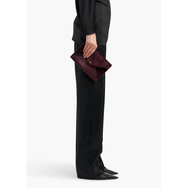Khaite Grace Envelope Clutch in Rouge Noir | Clutch Bags | Coveti