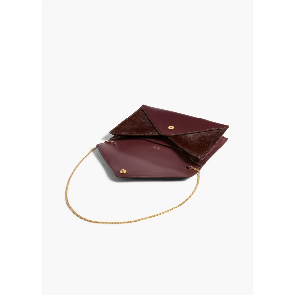Khaite Grace Envelope Clutch in Rouge Noir | Clutch Bags | Coveti