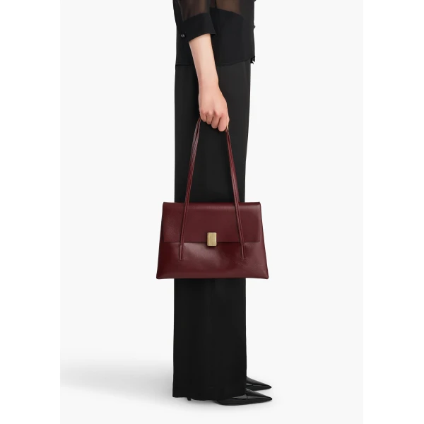 Khaite Soft Blake Shoulder Bag in Bordeaux | Shoulder & Crossbody Bags | Coveti