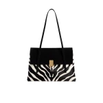 Khaite Soft Blake Shoulder Bag in Zebra Print Haircalf and Black Suede | Shoulder & Crossbody Bags | Coveti