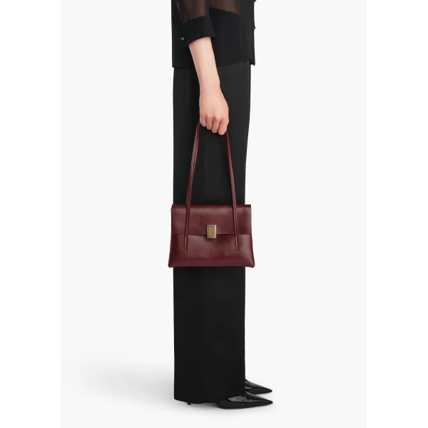 Khaite Soft Blake Small Shoulder Bag in Bordeaux | Shoulder & Crossbody Bags | Coveti