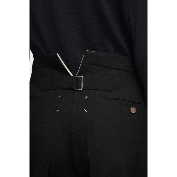 Maison Margiela Herringbone Wool Pleated Trousers in Black | Tailored pants | Coveti