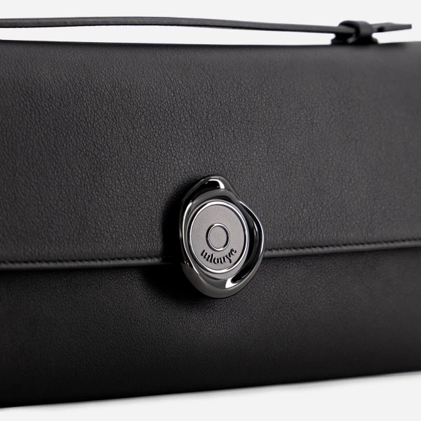 Mlouye Seal Double Clutch in Carbon | Clutch Bags | Coveti