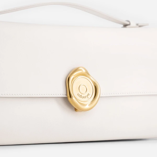 Mlouye Seal Double Clutch in Cream | Clutch Bags | Coveti