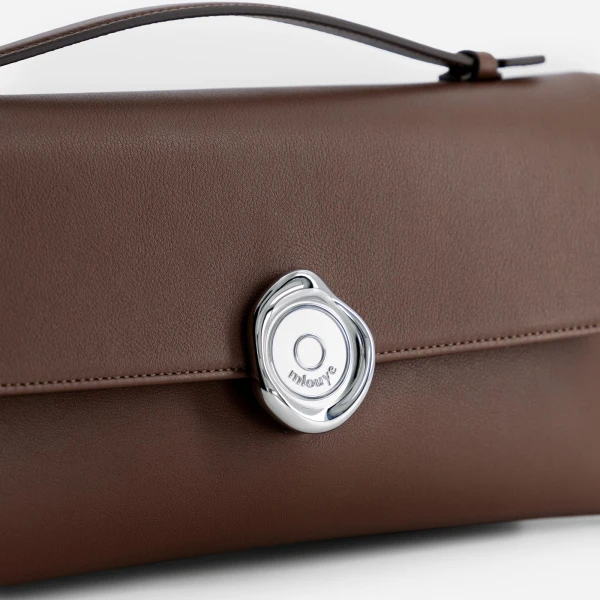 Mlouye Seal Double Clutch in Espresso | Clutch Bags | Coveti