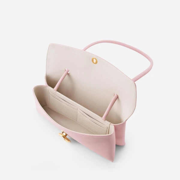 Mlouye Seal Flap Bag in Baby Pink | Shoulder & Crossbody Bags | Coveti