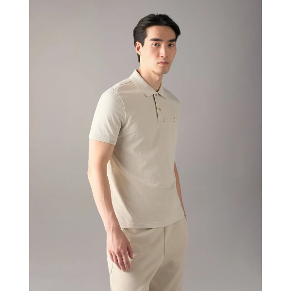 Moose Knuckles YUL Polo in Alabaster | T-shirts & vests | Coveti