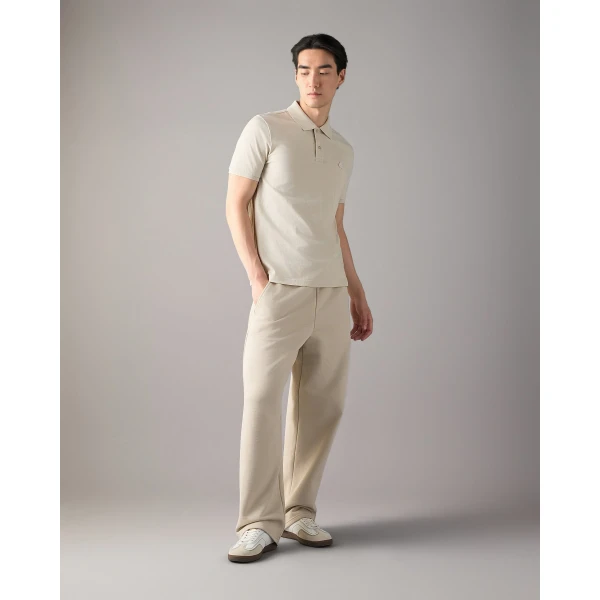 Moose Knuckles YUL Polo in Alabaster | T-shirts & vests | Coveti