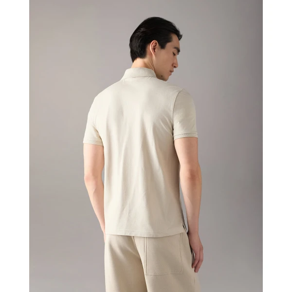 Moose Knuckles YUL Polo in Alabaster | T-shirts & vests | Coveti