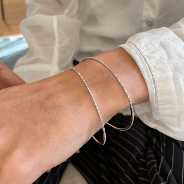 Rosa de la Cruz Eternity Bangle in 18K White Gold, White Diamond | Fine Bracelets | Coveti