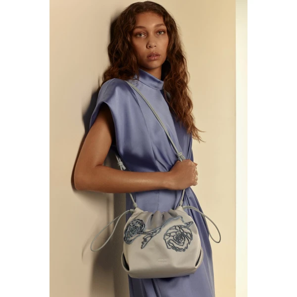 Scanlan Theodore Beaded Poppy Drawstring Bag in Blue | Bucket Bags | Coveti