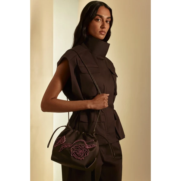 Scanlan Theodore Beaded Poppy Drawstring Bag in Chocolate Fuchsia | Bucket Bags | Coveti