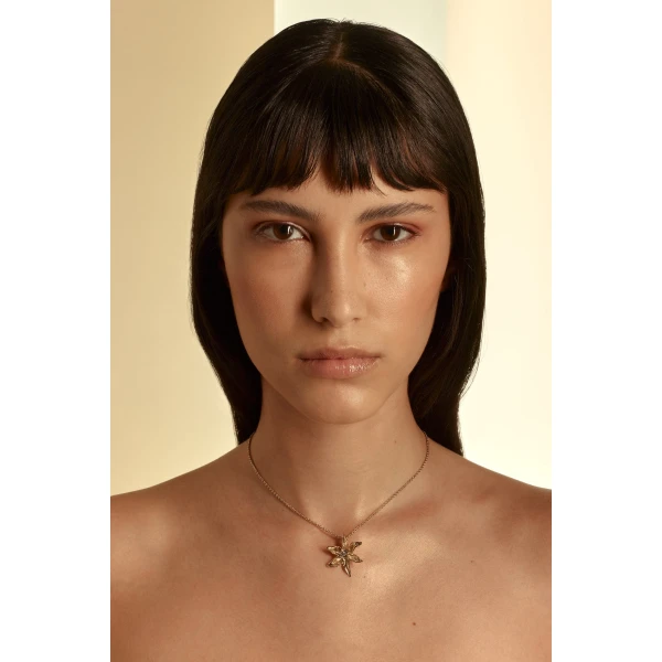 Scanlan Theodore Italian Lily Pendant Necklace in Light Gold Crystal | Necklace | Coveti