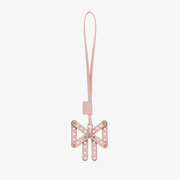Valextra Engineering Beauty Bow Charm in Peony Pink | Bag charms | Coveti