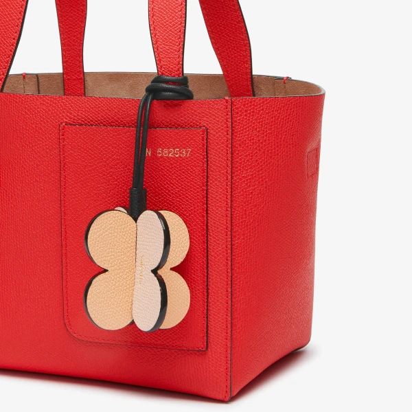Valextra Four-Leaf Clover Charm in Orange Sunset, Bonne Mine Pink and Black | Bag charms | Coveti