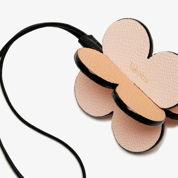 Valextra Four-Leaf Clover Charm in Orange Sunset, Bonne Mine Pink and Black | Bag charms | Coveti