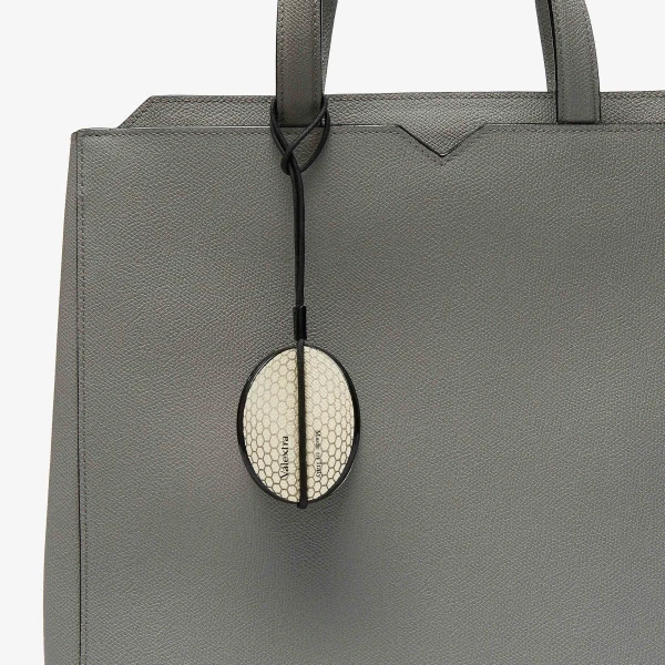 Valextra Golf Ball Charm in Pergamena White and Black | Bag charms | Coveti
