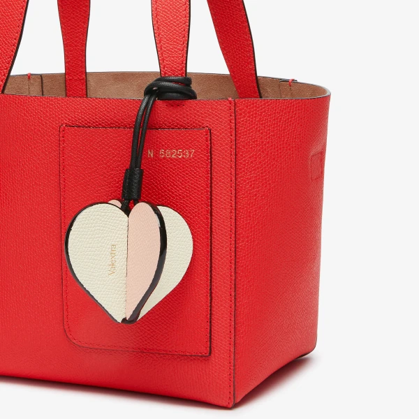 Valextra Heart Charm in Pergamena White, Bonne Mine Pink and Black | Bag charms | Coveti