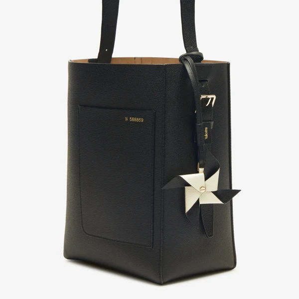 Valextra Pinwheel Charm in Black and Pergamena White | Bag charms | Coveti