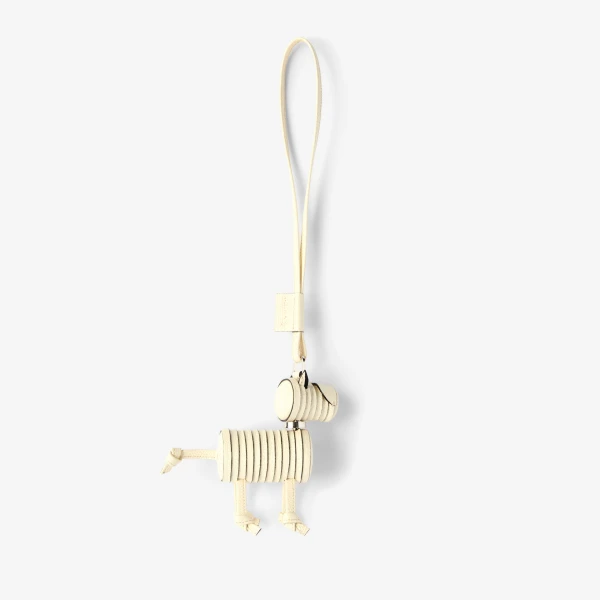 Valextra Puppy Dog Charm in Pergamena White and Black | Bag charms | Coveti