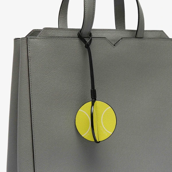 Valextra Tennis Ball Charm in Lime Yellow, Pergamena White and Black | Bag charms | Coveti