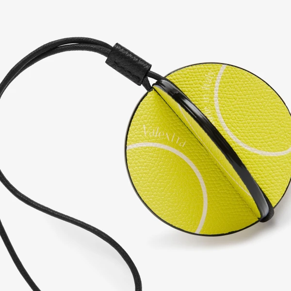 Valextra Tennis Ball Charm in Lime Yellow, Pergamena White and Black | Bag charms | Coveti
