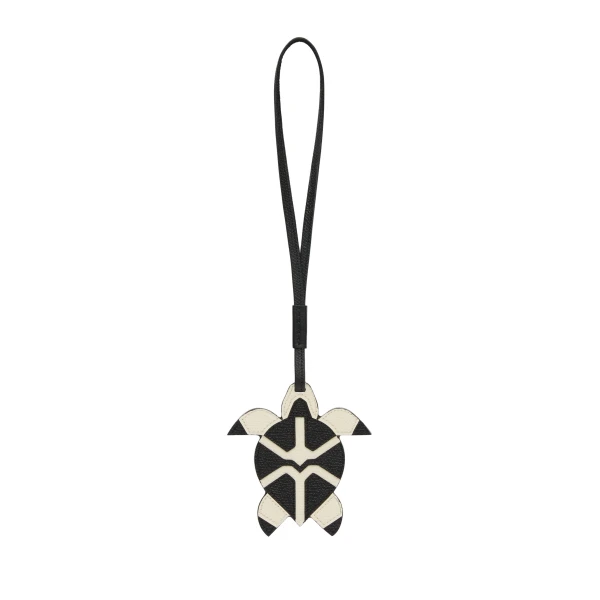 Valextra Turtle Charm in Pergamena White and Black | Bag charms | Coveti