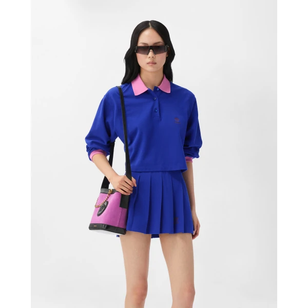 Versace Embroidered-Logo Cotton Piqué Pleated Mini Skirt in Blue, view 2 | Pleated Skirts
