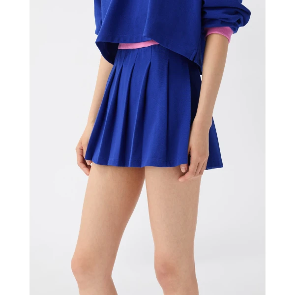 Versace Embroidered-Logo Cotton Piqué Pleated Mini Skirt in Blue, view 4 | Pleated Skirts