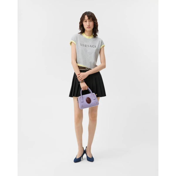 Versace Pleated Wool-Mohair Mini Skirt in Black, view 2 | Pleated Skirts